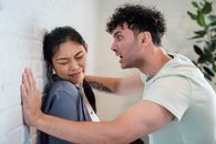Woman Closing Her Eyes While the Man is Screaming