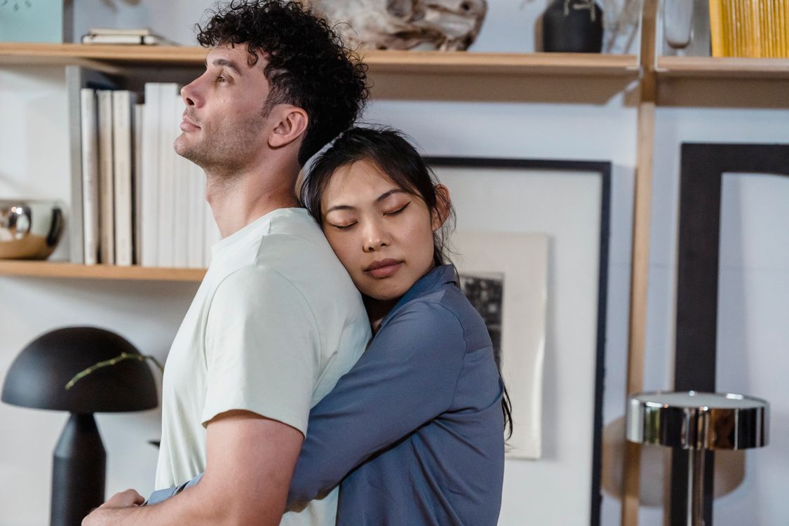 A Woman Hugging Her Partner from Behind · Free Stock Photo