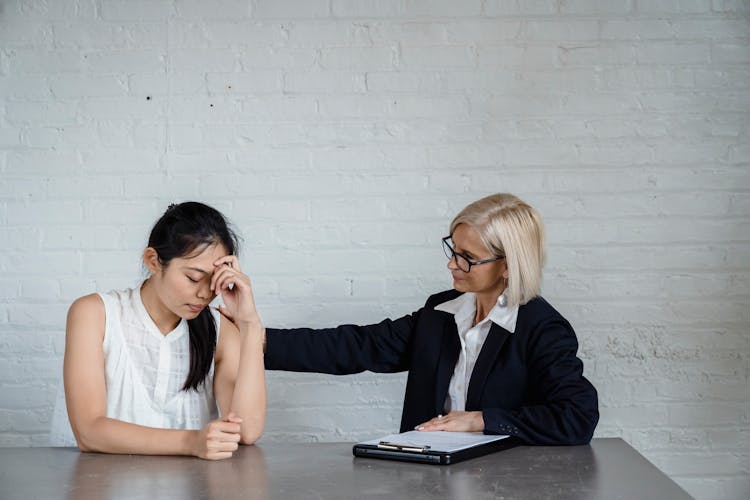 Adult Woman Tapping The Person's Back 