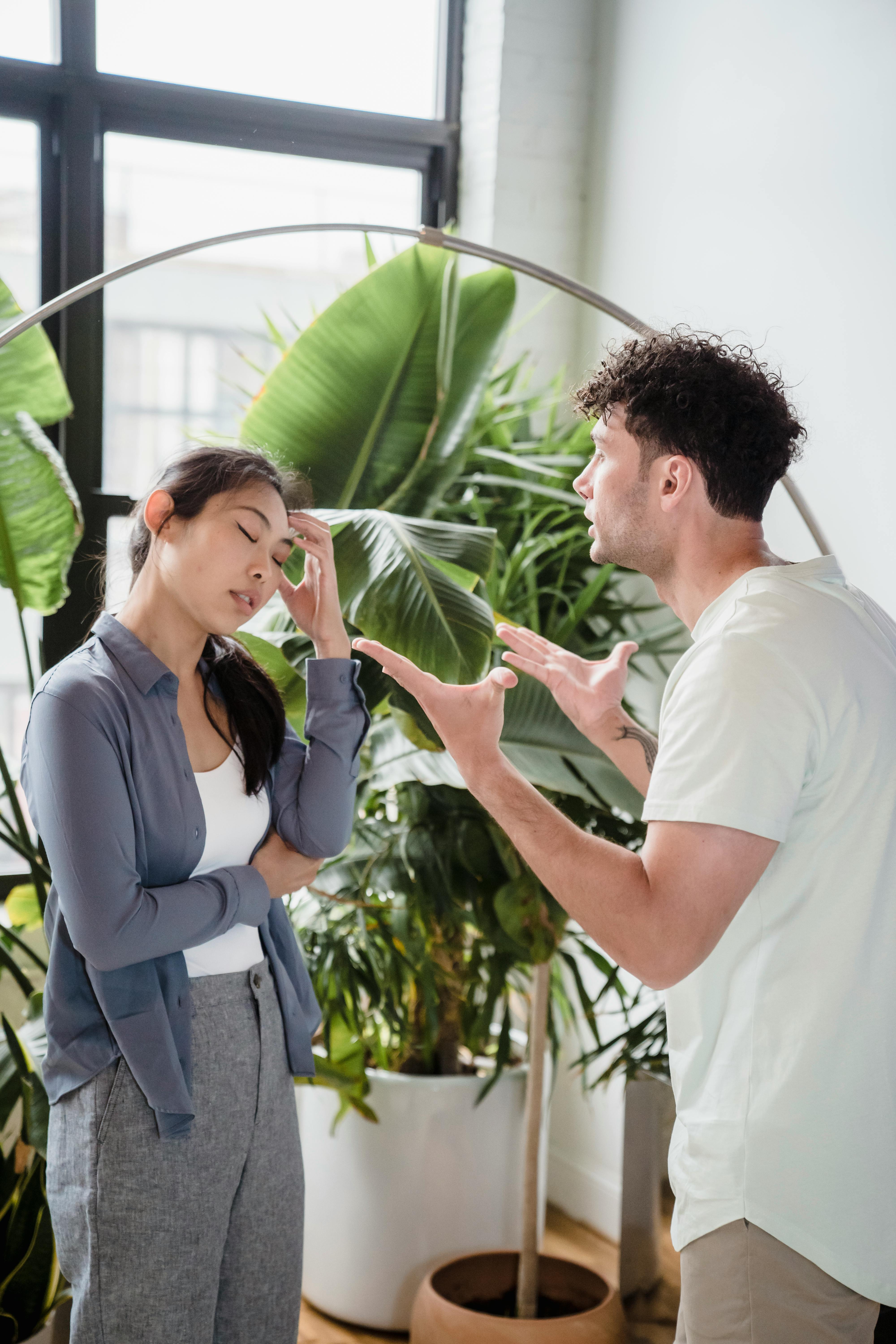 angry man talking to a woman