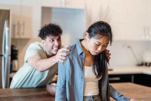 Free A couple experiencing emotions and tension in a modern kitchen setting. Stock Photo