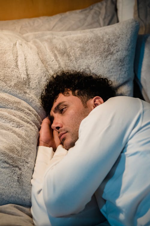 Man Lying Down on Pillow