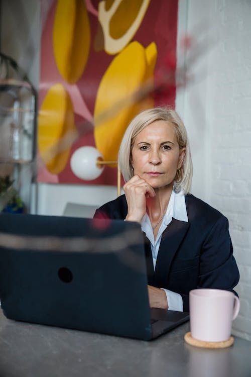Portrait of a Businesswoman Sitting in Front of a Laptop