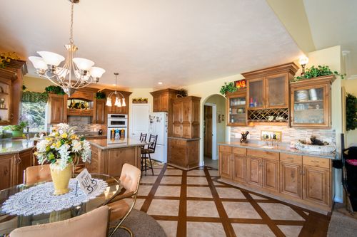 Free Beautifully designed wooden kitchen featuring vintage decor and classic style. Stock Photo