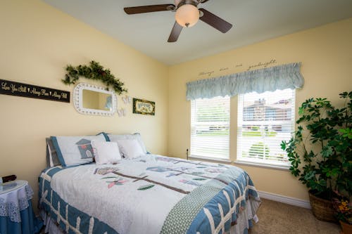 Free Ceiling Fan above a Bed Stock Photo