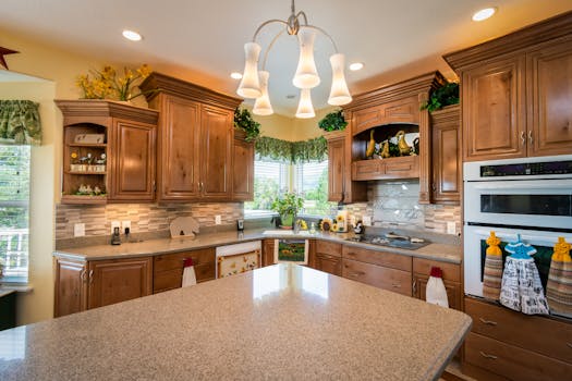 Beautiful kitchen with wooden cabinets and a vintage chandelier, perfect for a cozy home feel.
