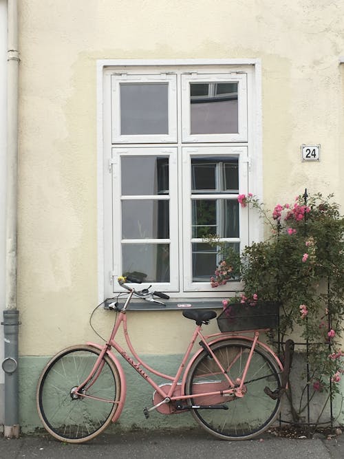 A Bicycle Parked Near the Window