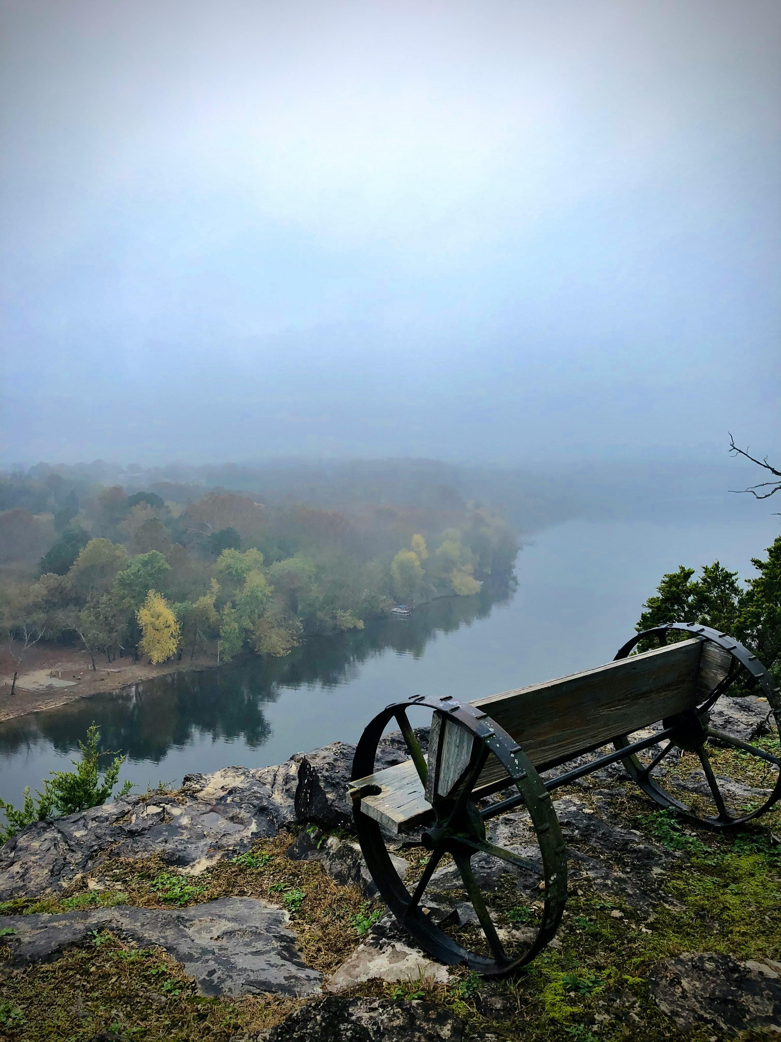 A Wagon Wheel Bench Overlooking a Lake in Holiday Island AR