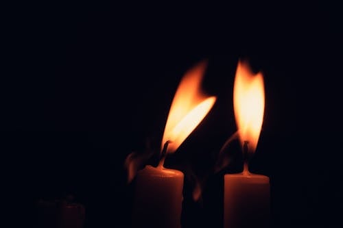 Lighted Candles on a Black Background