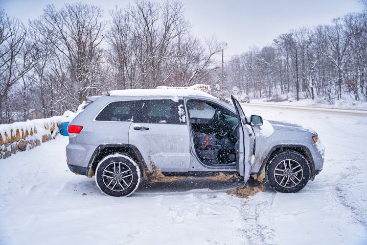 Gray Suv Car Parked On Snow Covered Ground 