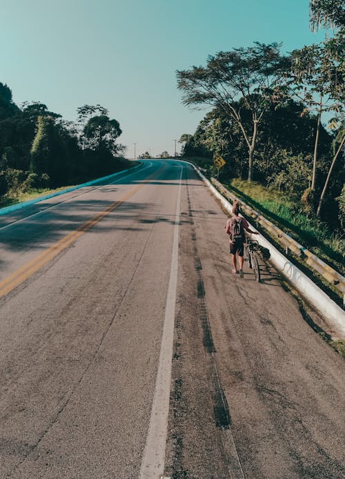 Person with Backpack on Road