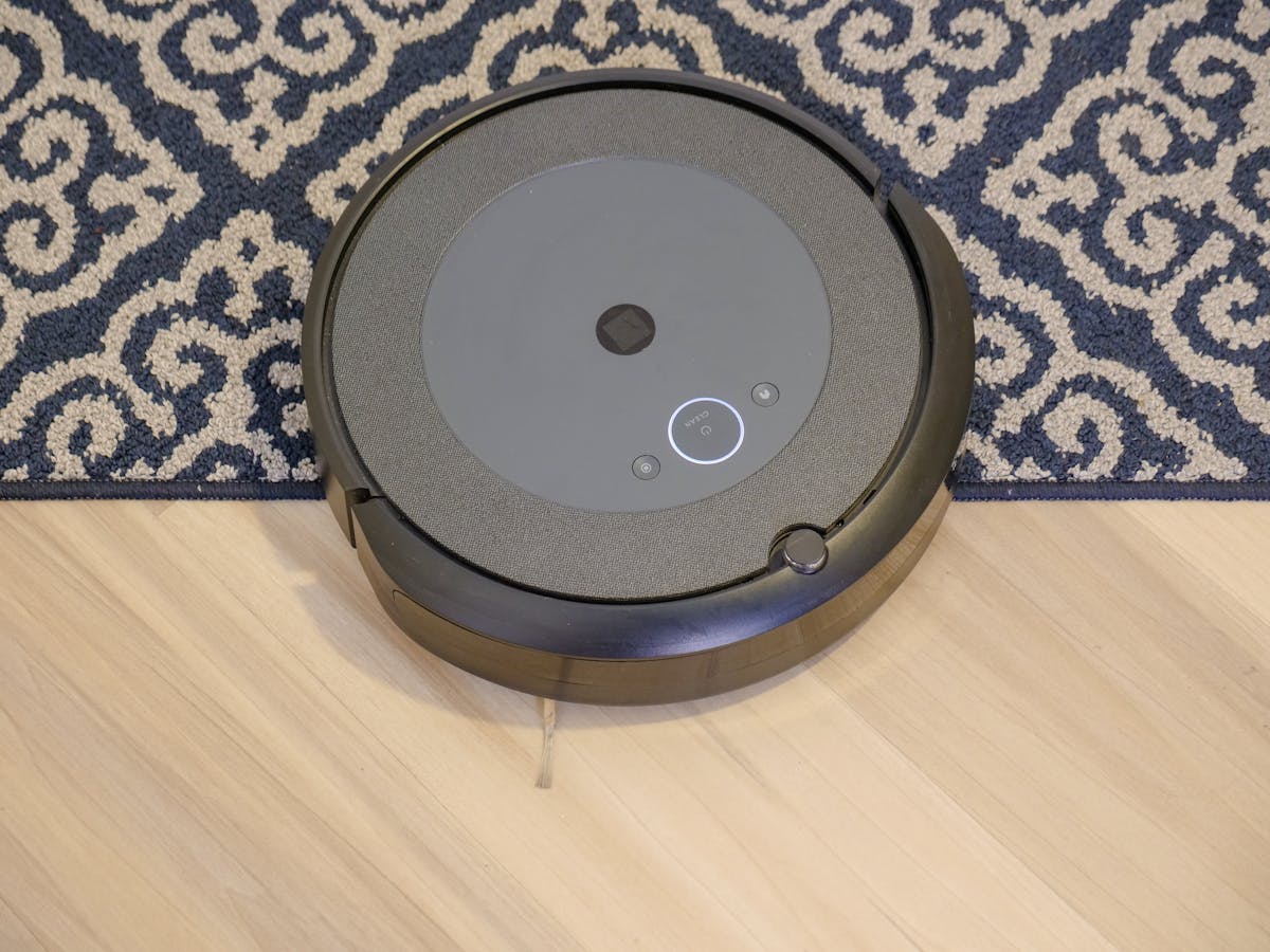 Modern Vacuum Cleaner on Wooden Flooring