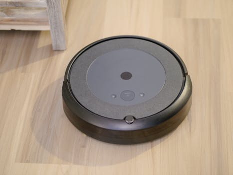 High-tech robotic vacuum cleaner efficiently cleaning modern floor indoors.