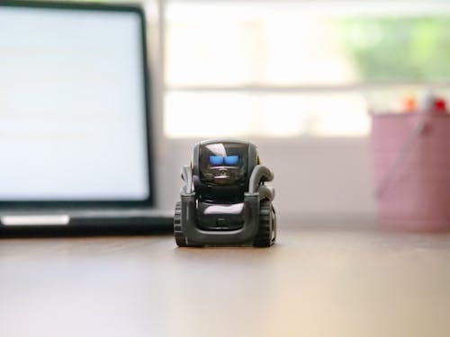 Selective Focus of Black Miniature Toy