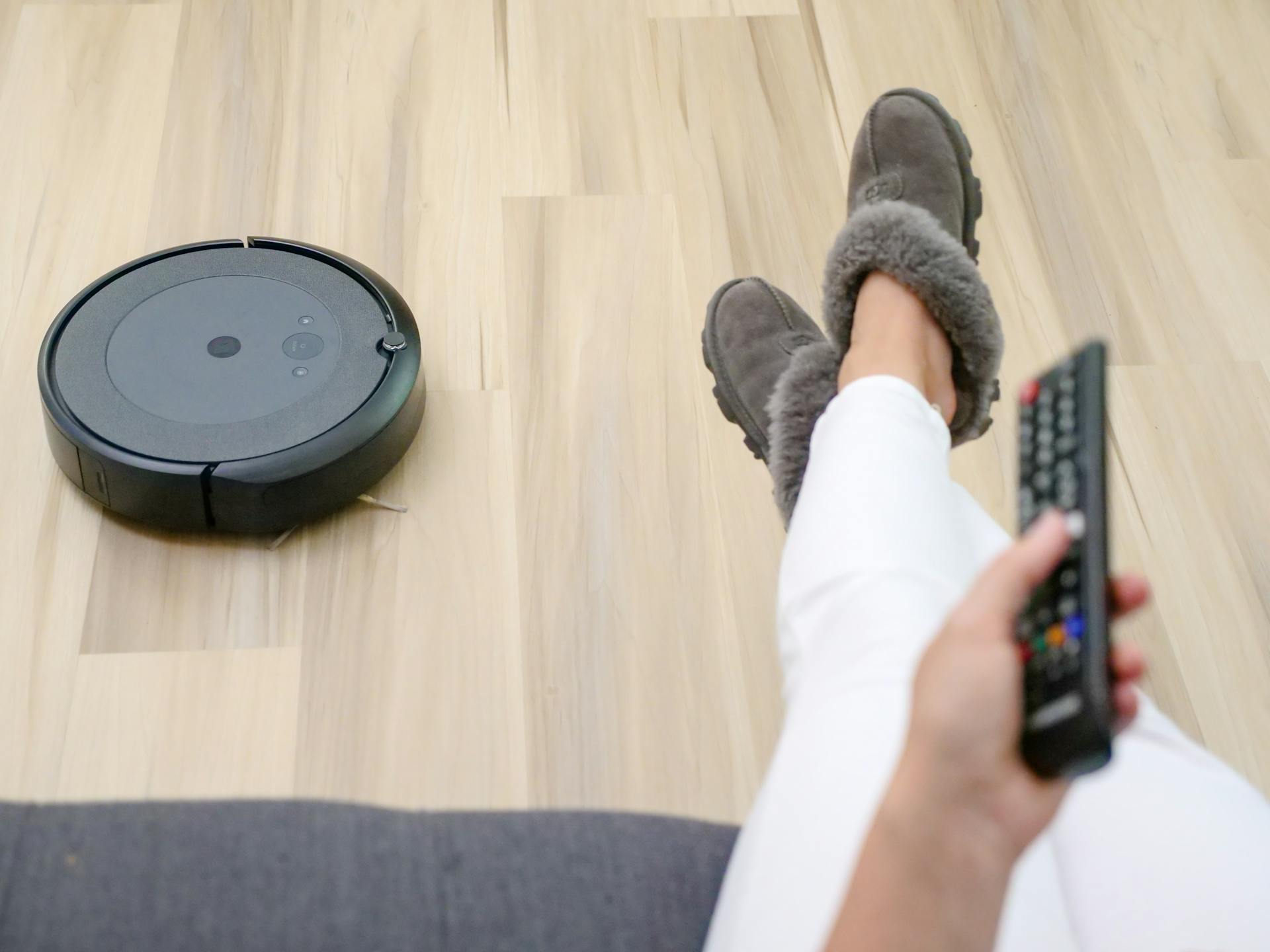 Black Vacuum Cleaner on Wooden Flooring