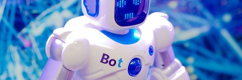 High-tech humanoid robot with LED face display, showcasing modern robotics and innovation.