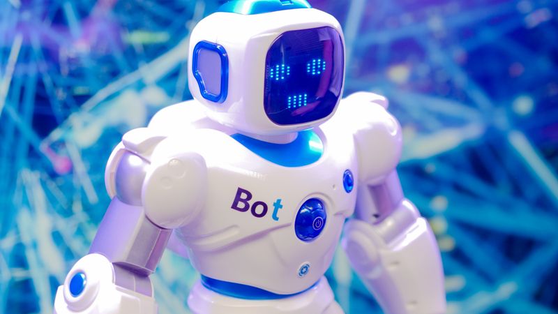 High-tech humanoid robot with LED face display, showcasing modern robotics and innovation.