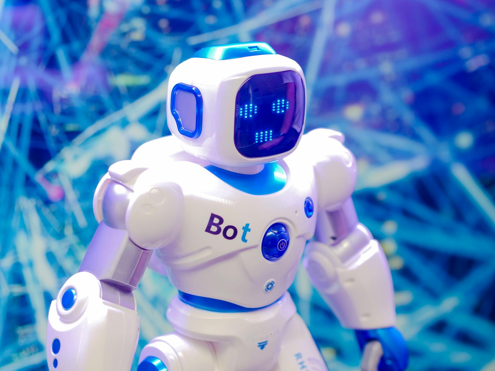 robot with bot written on it standing straight