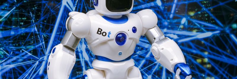 Advanced humanoid robot with glowing blue accents in a digital network setting.