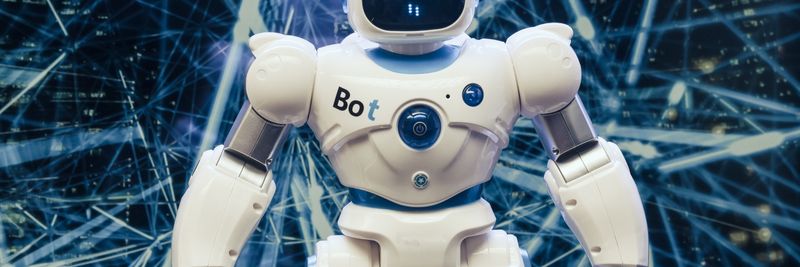 A modern humanoid robot with luminous features set against a digital network backdrop.