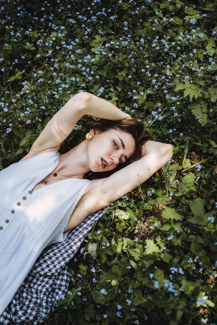 Woman In White Dress Lying On The Ground