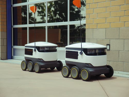 Delivery Robots Parked Beside Building