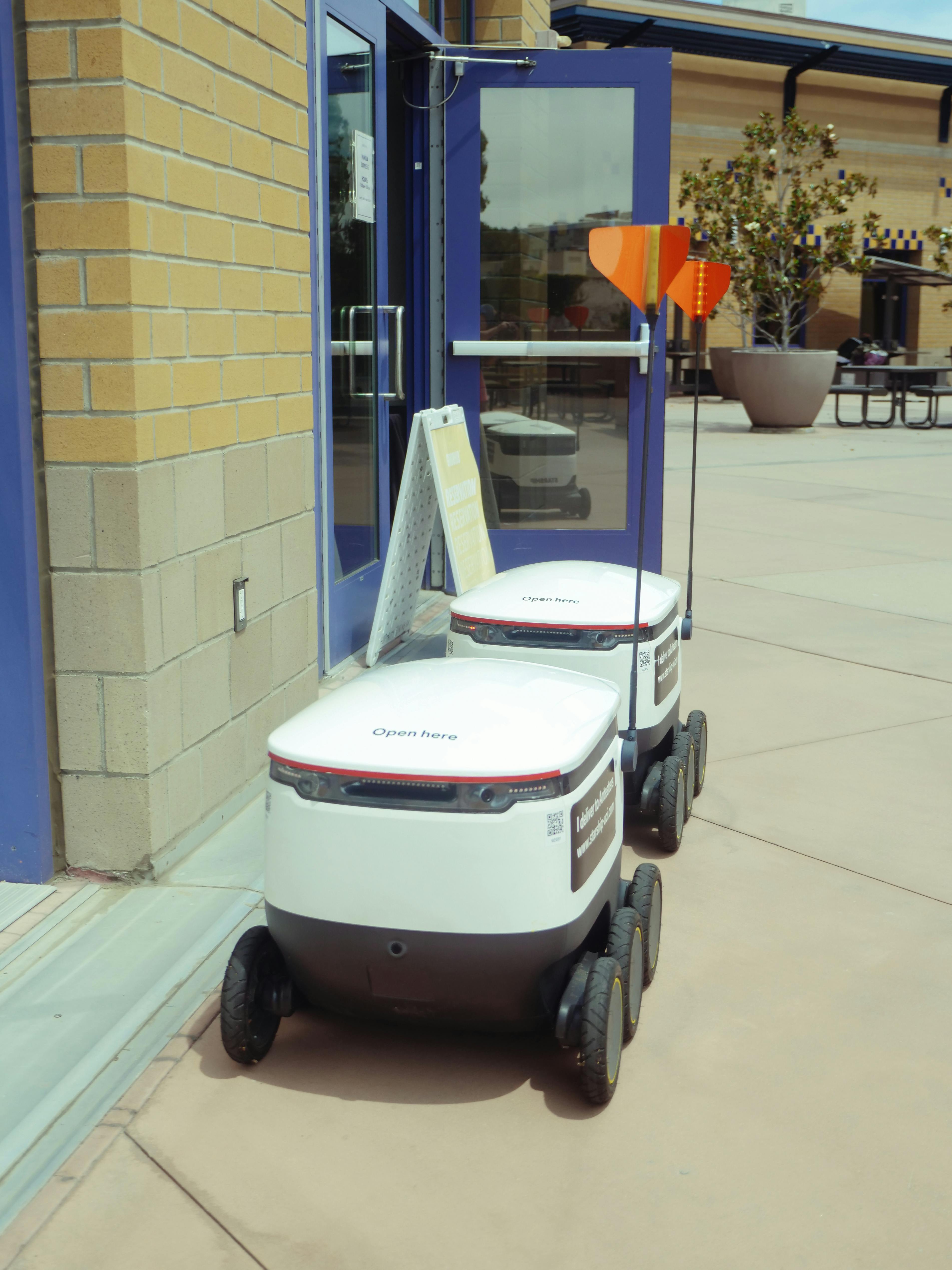 delivery robots beside building