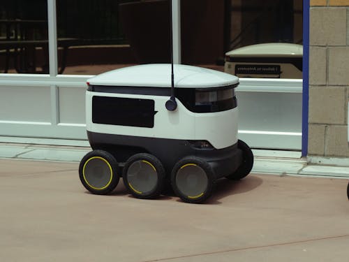 Delivery Robot Beside Glass Window