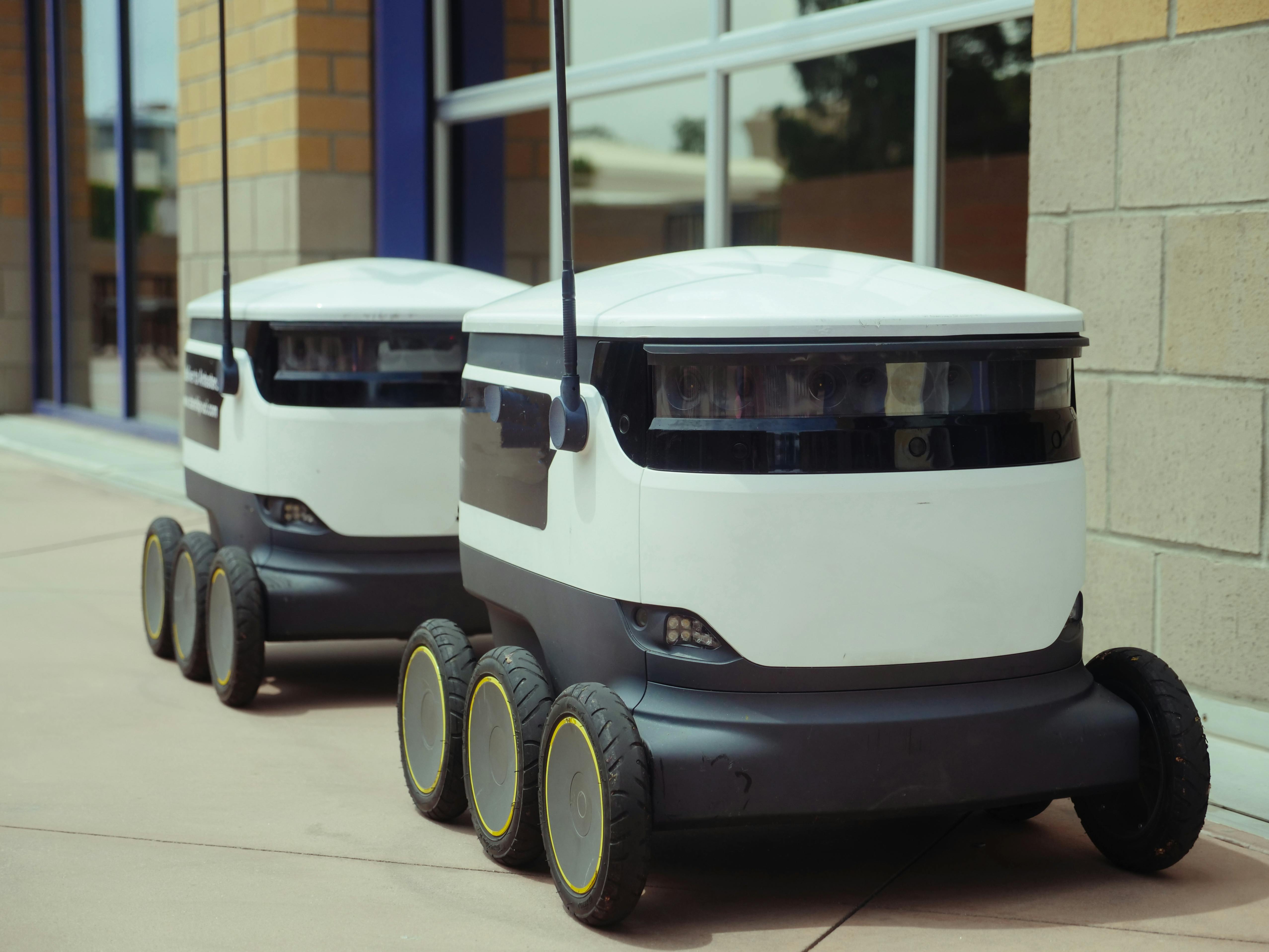 Delivery Robots Beside Building · Free Stock Photo