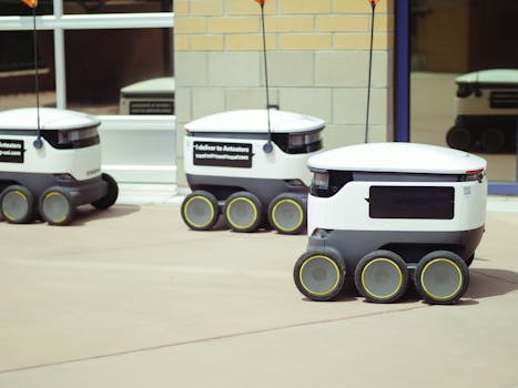 Autonomous delivery robots on a city sidewalk demonstrating modern technology for urban mobility.