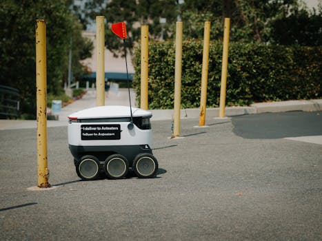 Futuristic delivery robot autonomously navigates an outdoor path, showcasing modern technology.