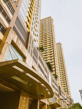 A striking view of modern high-rise buildings in Manila under a clear sky.