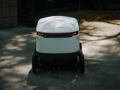 Autonomous delivery robot in urban setting, showcasing modern technology.