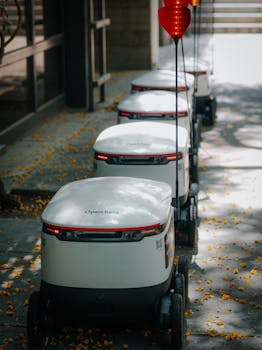 Futuristic robots aligned on a path, showcasing modern delivery technology.