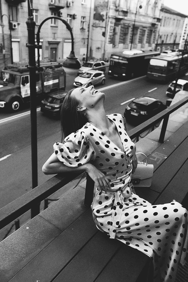 Black And White Photo Of Woman Wearing Polka Dots Dress