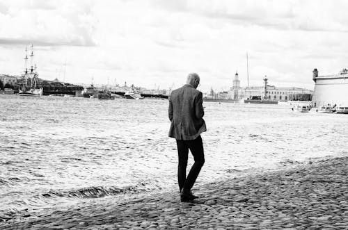 Man Walking on Seashore