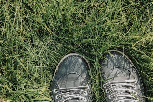 Close-Up Shot of Shoes on the Grass
