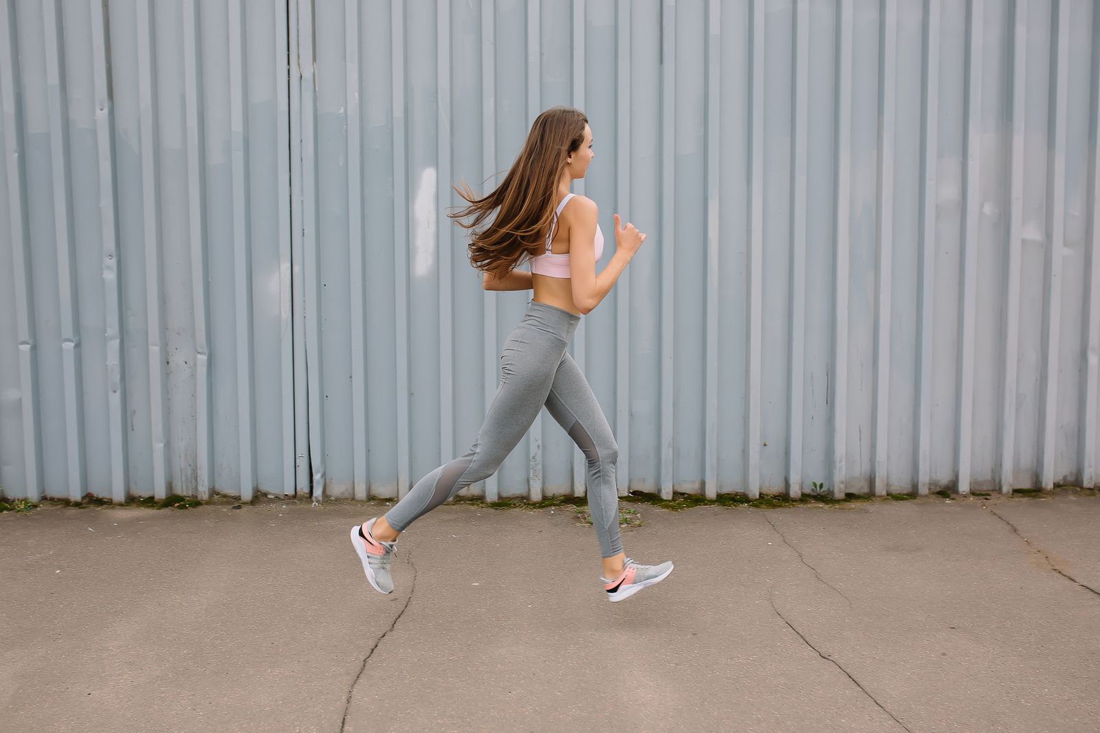 Bright outdoor walking scene focused on legs for comparing thigh-high compression stockings and compression leggings