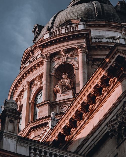 Free Dramatic neoclassical architecture of St Stephen's Basilica centrally framed against a twilight sky. Stock Photo