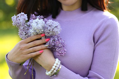 Close up of a Woman Holding Flowers