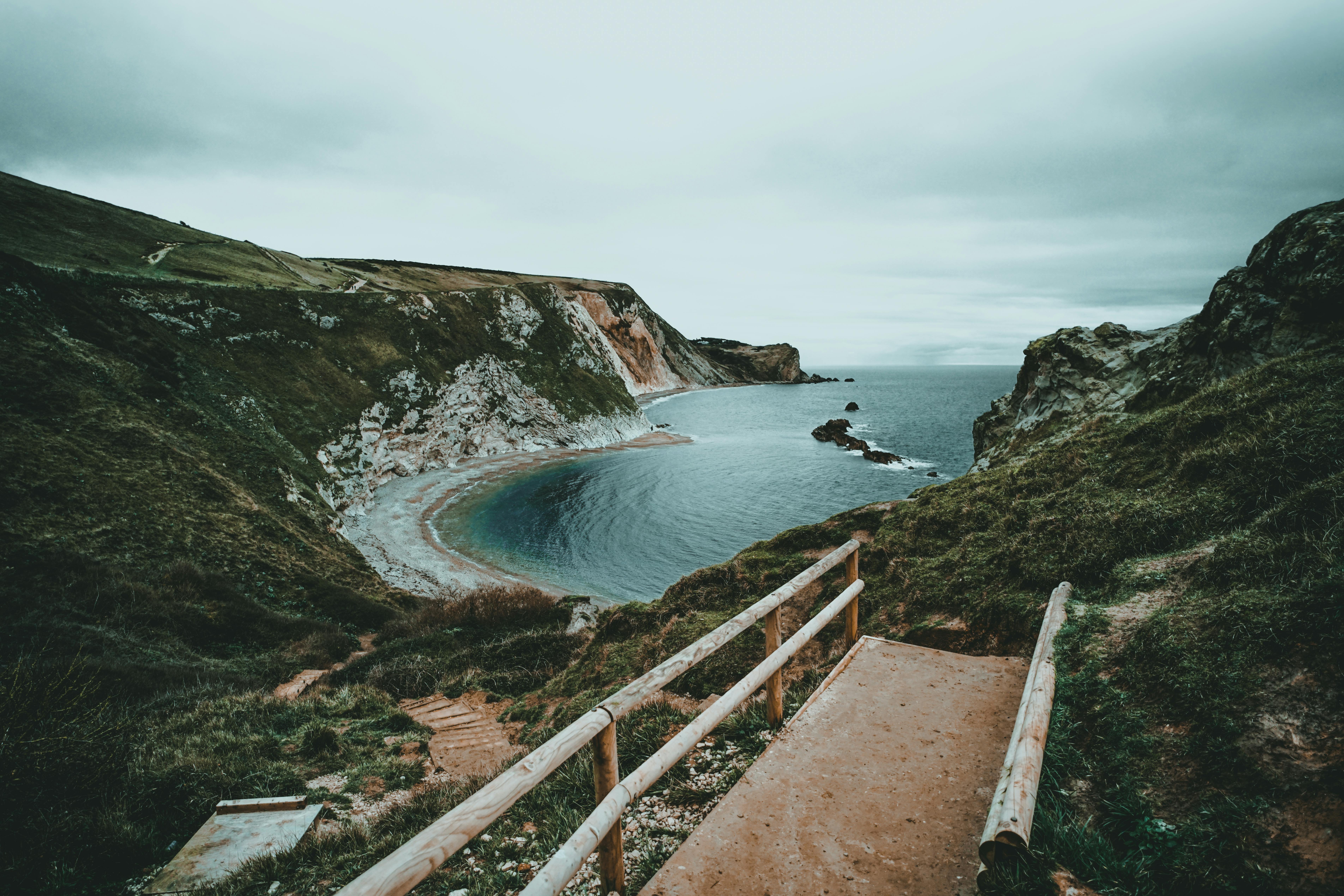 Discover the breathtaking beauty of England's Dorset coastline with its stunning cliffs and serene sea views.