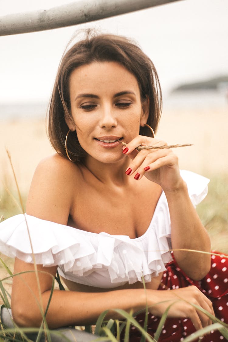 Woman In White Off Shoulder Crop Top Biting Brown Grass