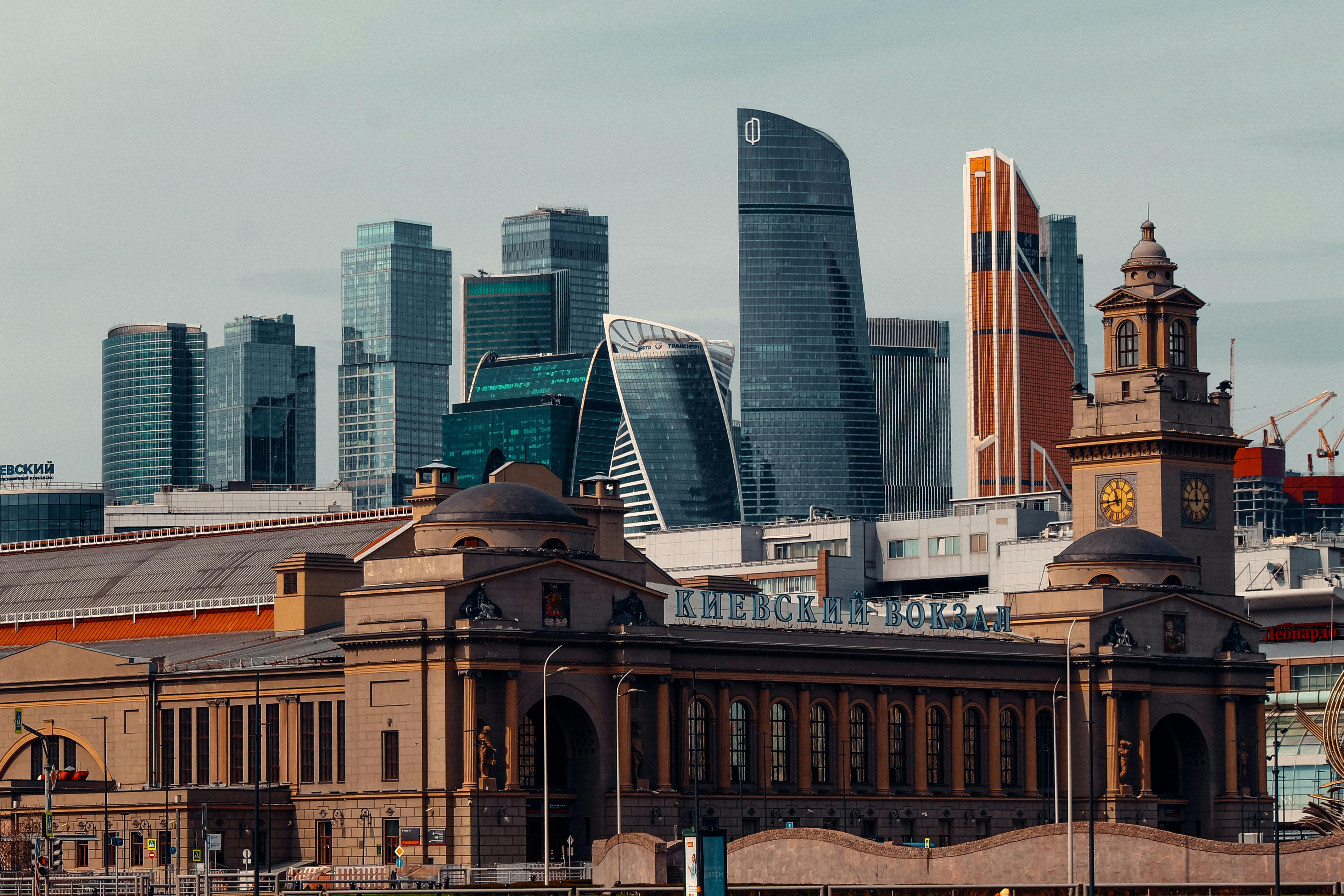 View of Moscow's modern skyline with the historic Kievsky railway station in the foreground.