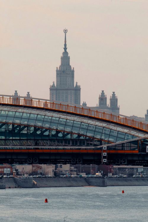 Free Dramatic view of a modern bridge with Moscow skyscrapers in the background. Stock Photo