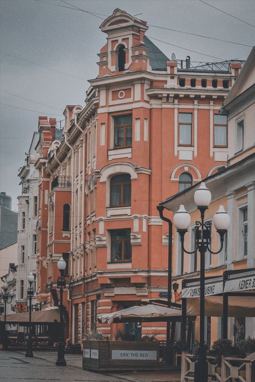 Free Elegant European street featuring historic architecture and cozy cafes, perfect for travel and lifestyle imagery. Stock Photo