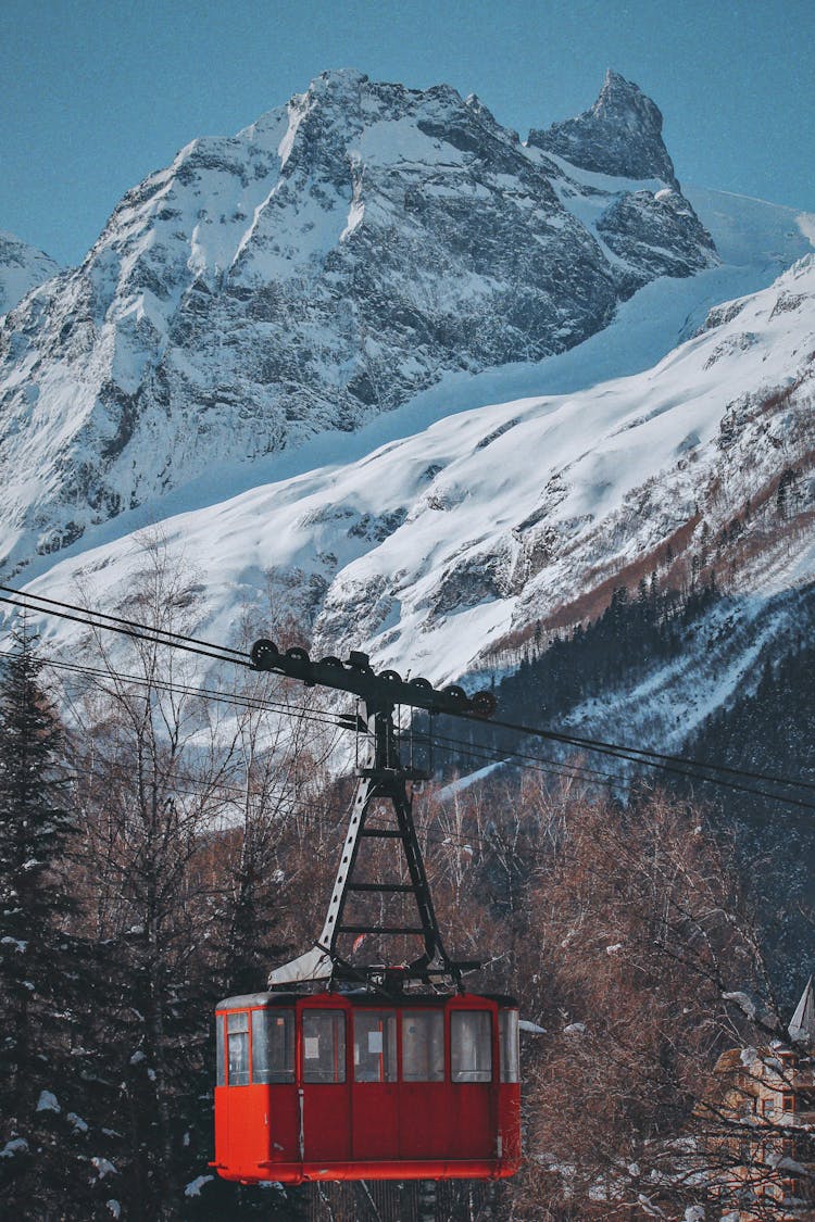 Gondola Lift In Snowy Mountains
