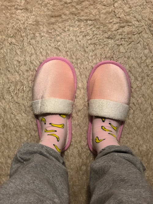 Photo of a Person Wearing Pink Slippers