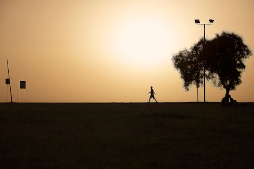 Silhouette of a Person Walking