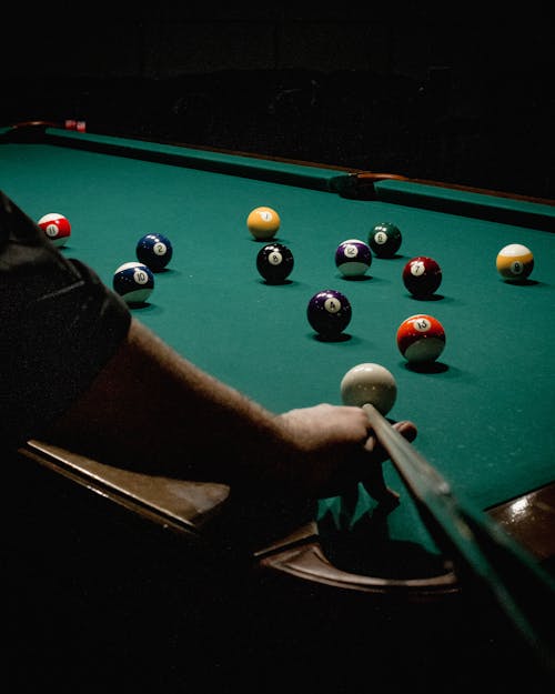Free A Person Playing Billiards Stock Photo
