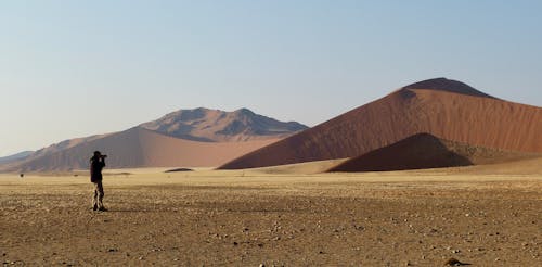 Free Person Taking Picture Of A Desert Landscape Stock Photo